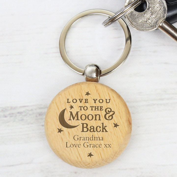 Buy Personalised Moon & Back Wooden Keyring at www.giftsfinder.co.uk