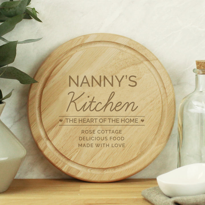 Buy Personalised Heart of the Home Round Wooden Chopping Board available now at www.giftsfinder.co.uk