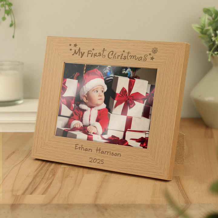 Buy Personalised My First Christmas 7x5 Landscape Wooden Photo Frame at www.giftsfinder.co.uk