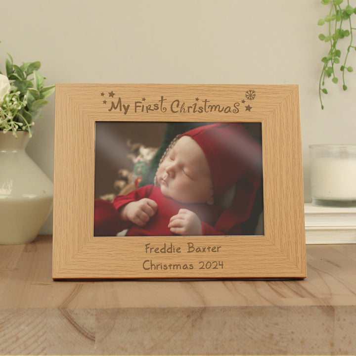 Buy Personalised My First Christmas 7x5 Landscape Wooden Photo Frame at www.giftsfinder.co.uk