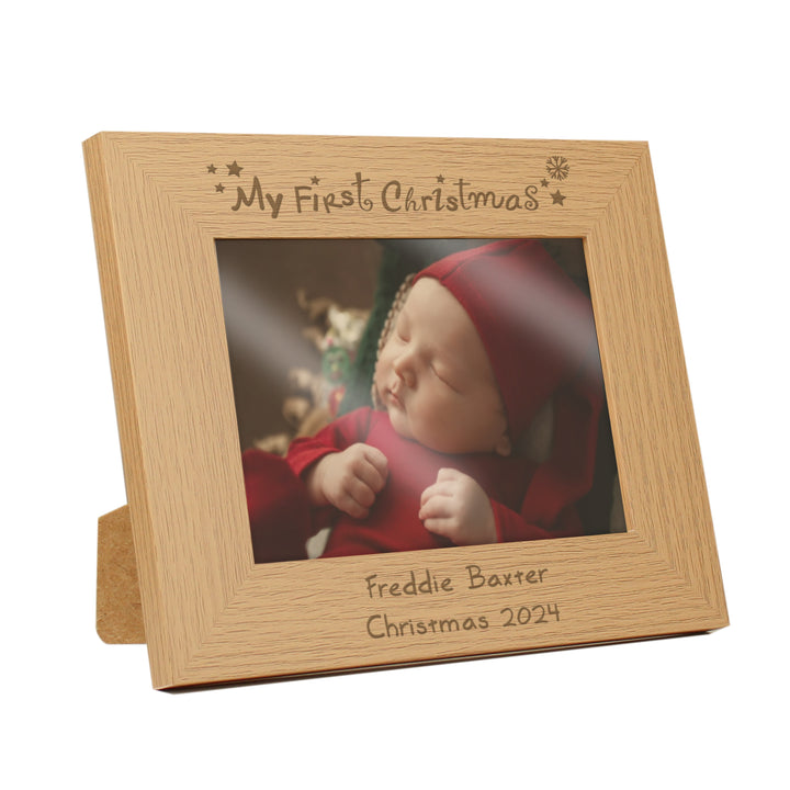 Buy Personalised My First Christmas 7x5 Landscape Wooden Photo Frame at www.giftsfinder.co.uk