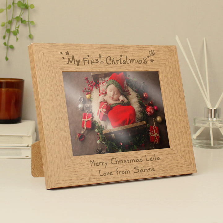 Buy Personalised My First Christmas 7x5 Landscape Wooden Photo Frame at www.giftsfinder.co.uk