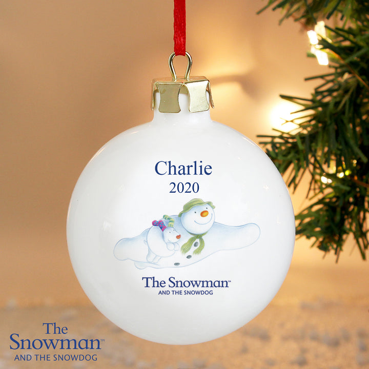 Buy Personalised The Snowman and the Snowdog Flying Bauble at www.giftsfinder.co.uk