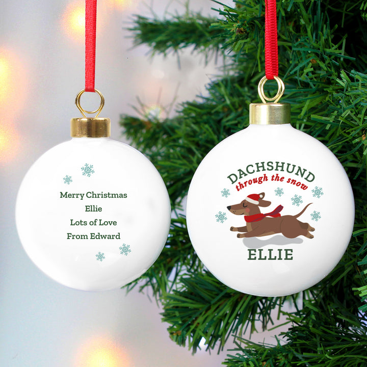 Buy Personalised 'Dachshund Through The Snow' Christmas Tree Bauble available now at www.giftsfinder.co.uk