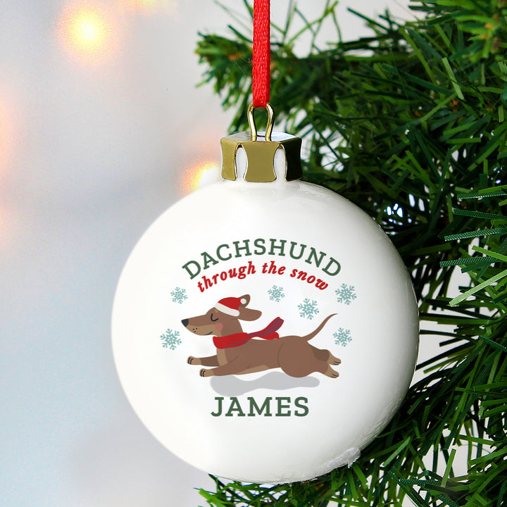 Buy Personalised 'Dachshund Through The Snow' Christmas Tree Bauble available now at www.giftsfinder.co.uk