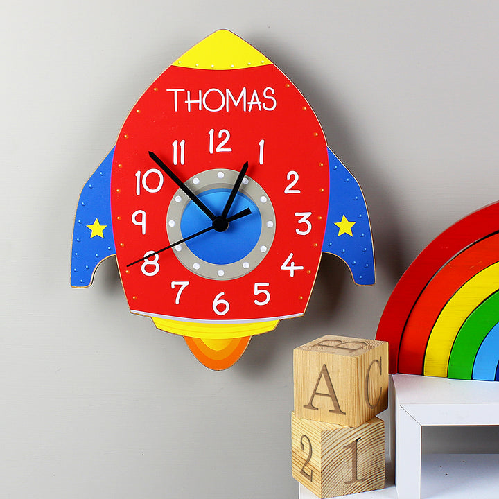 Buy Personalised Rocket Shape Wooden Clock at www.giftsfinder.co.uk