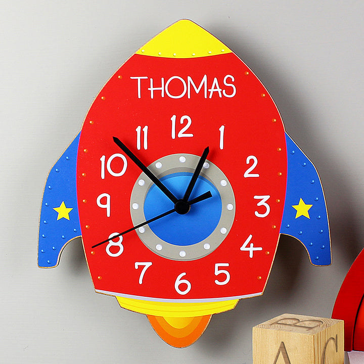 Buy Personalised Rocket Shape Wooden Clock at www.giftsfinder.co.uk