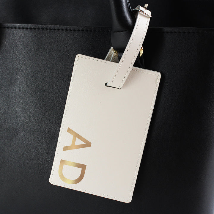 Buy Personalised Gold Initials Cream Luggage Tag at www.giftsfinder.co.uk