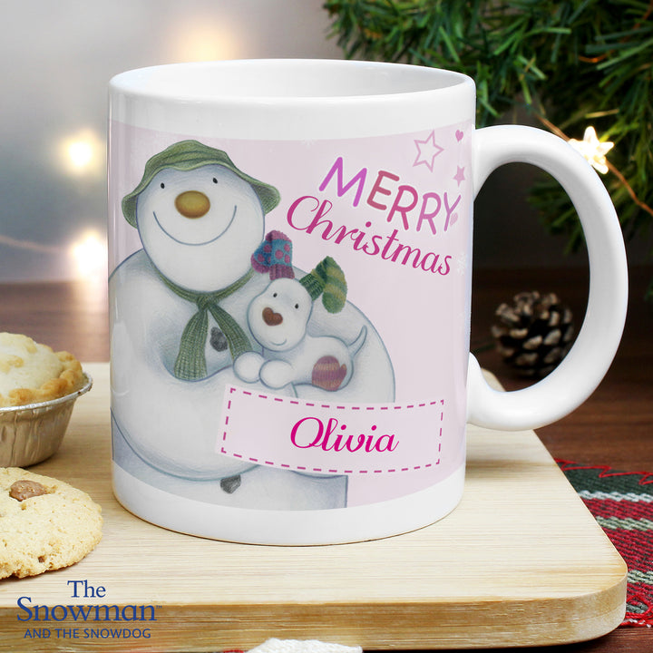 Buy Personalised The Snowman and the Snowdog Pink Mug at www.giftsfinder.co.uk