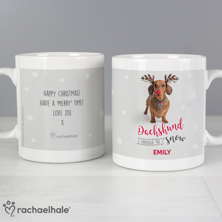 Buy Personalised Rachael Hale Christmas Dachshund Through the Snow Mug at www.giftsfinder.co.uk