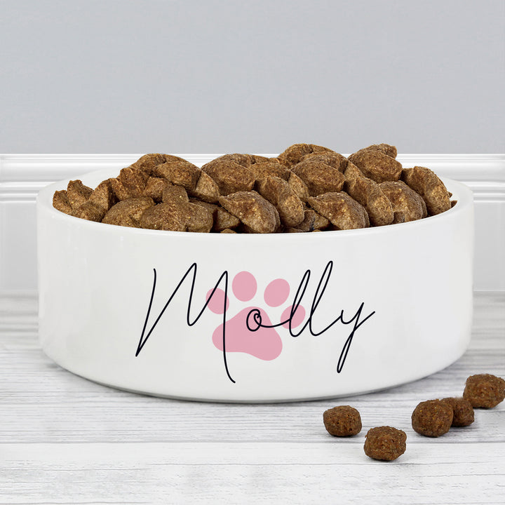 Buy Personalised Pink Pawprint Name 14cm Medium Pet Bowl For Dogs And Cats at www.giftsfinder.co.uk