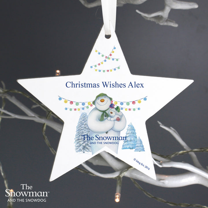 Buy Personalised The Snowman and the Snowdog Wooden Star Decoration at www.giftsfinder.co.uk