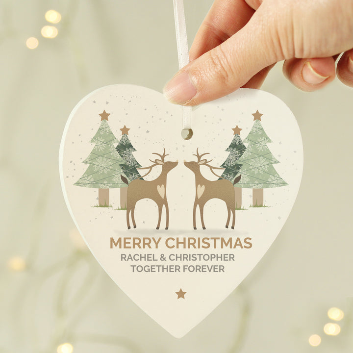 Buy Personalised Reindeer Couple Wooden Heart Decoration at www.giftsfinder.co.uk