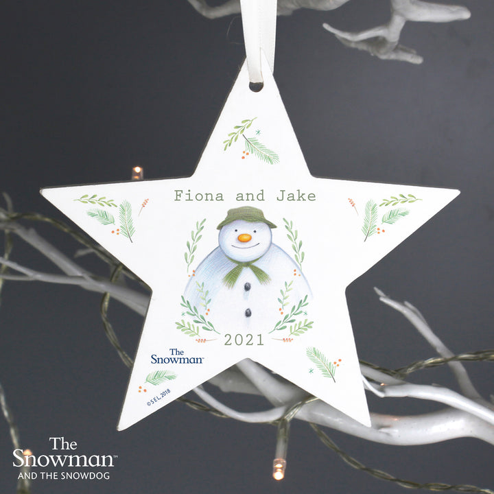 Buy Personalised The Snowman Winter Garden Wooden Star Decoration at www.giftsfinder.co.uk