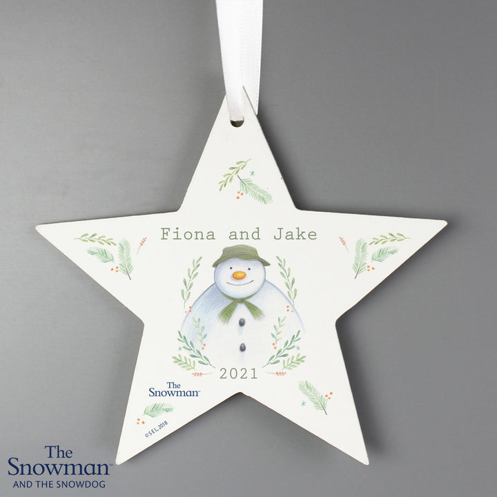 Buy Personalised The Snowman Winter Garden Wooden Star Decoration at www.giftsfinder.co.uk