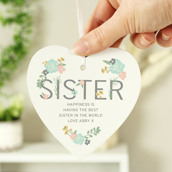 Buy Personalised Sister Floral Wooden Heart Decoration at www.giftsfinder.co.uk