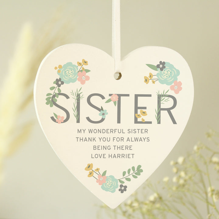 Buy Personalised Sister Floral Wooden Heart Decoration at www.giftsfinder.co.uk