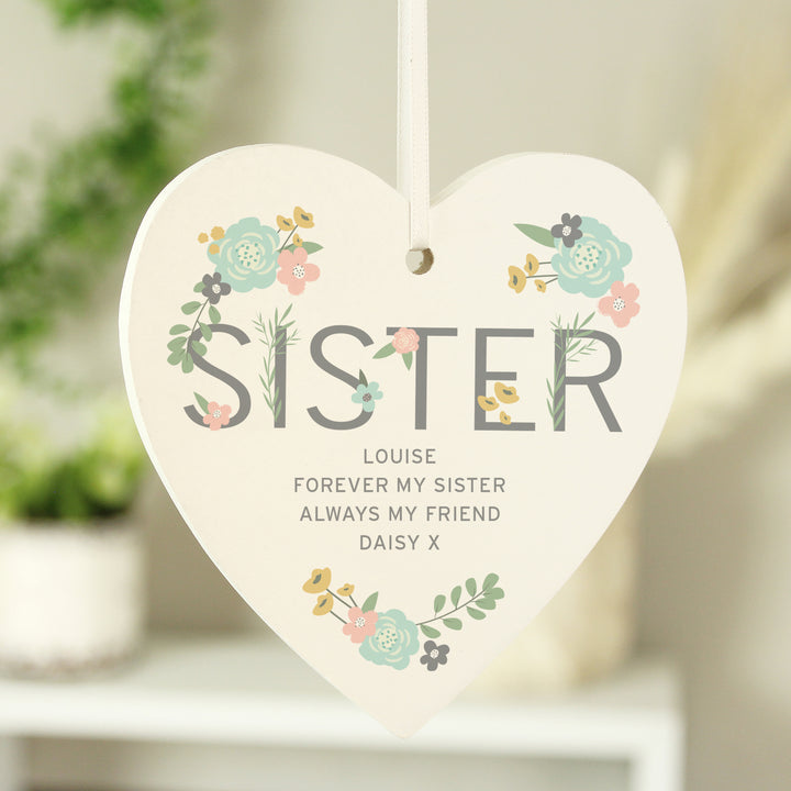 Buy Personalised Sister Floral Wooden Heart Decoration at www.giftsfinder.co.uk