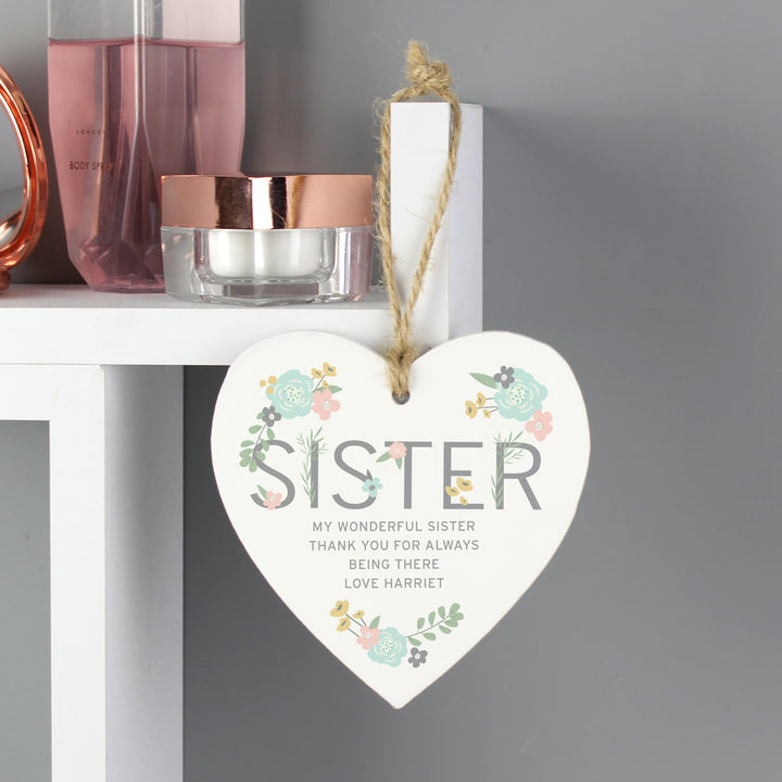 Buy Personalised Sister Floral Wooden Heart Decoration at www.giftsfinder.co.uk