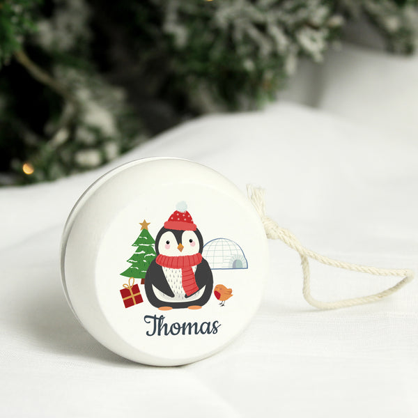 Buy Personalised Christmas Penguin White Wooden Yoyo available now at www.giftsfinder.co.uk