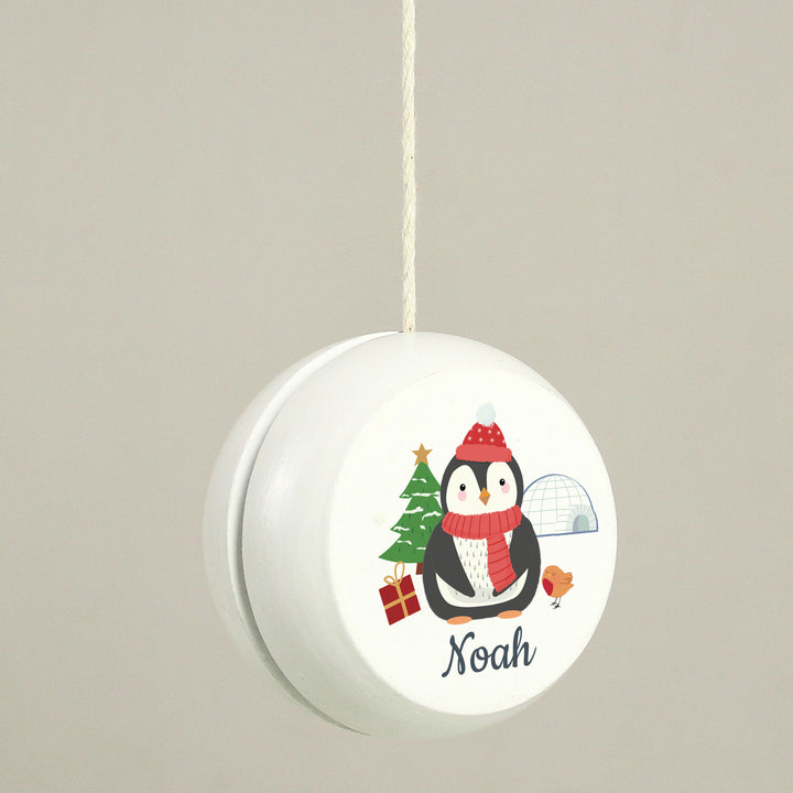 Buy Personalised Christmas Penguin White Wooden Yoyo available now at www.giftsfinder.co.uk