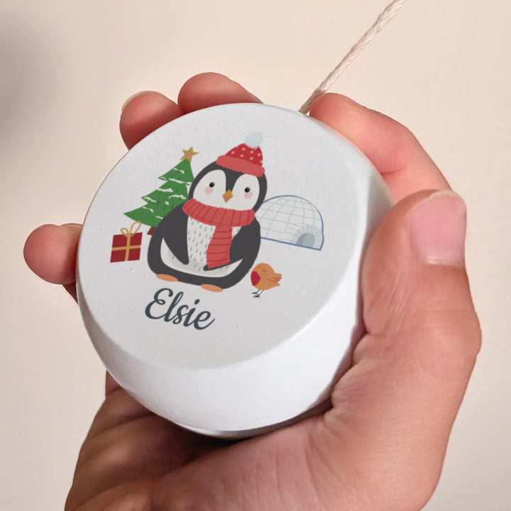 Buy Personalised Christmas Penguin White Wooden Yoyo available now at www.giftsfinder.co.uk