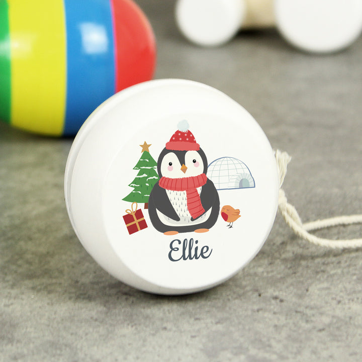 Buy Personalised Christmas Penguin White Wooden Yoyo available now at www.giftsfinder.co.uk