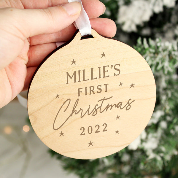 Buy Personalised Baby's First Christmas Round Wooden Decoration available now at www.giftsfinder.co.uk