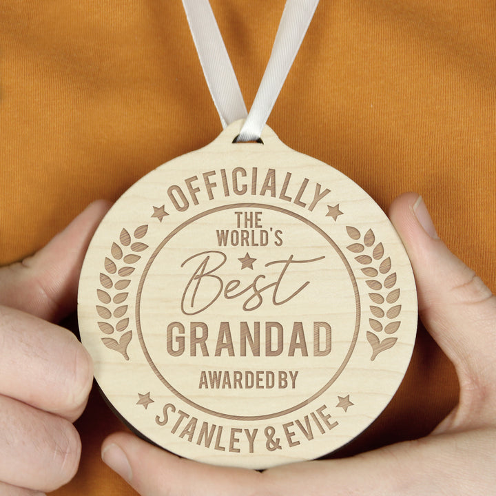 Buy Personalised Officially The Best Round Wooden Medal at www.giftsfinder.co.uk