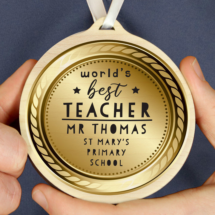 Personalised World’s Best Teacher Round Wooden Medal in gift category Personalised Teacher Gifts