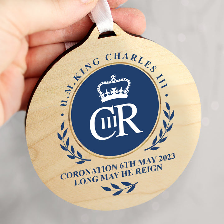 Buy King Charles III Blue Crest Coronation Commemorative Round Wooden Decoration available now at www.giftsfinder.co.uk