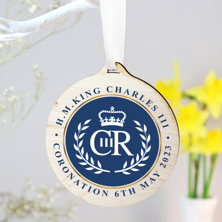 Buy King Charles III Blue Crest Coronation Commemorative Round Wooden Decoration available now at www.giftsfinder.co.uk