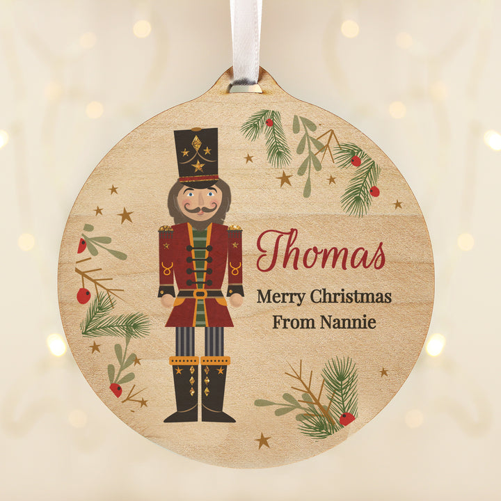 Buy Personalised Christmas Nutcracker Wooden Bauble available now at www.giftsfinder.co.uk