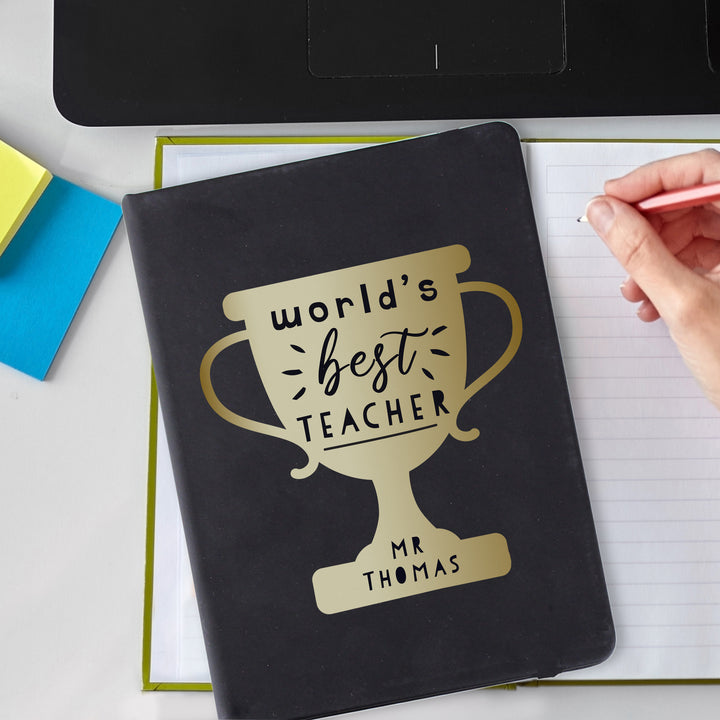 Personalised Worlds Best Teacher Trophy Black Hardback Notebook in gift category Personalised Teacher Gifts