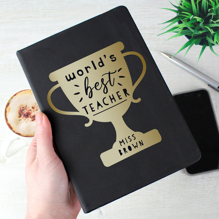 Personalised Worlds Best Teacher Trophy Black Hardback Notebook in gift category Personalised Teacher Gifts