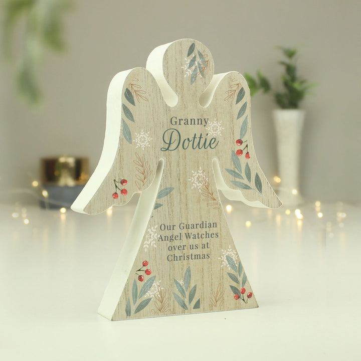 Personalised Christmas Foliage Wooden Angel Ornament available to buy at www.giftsfinder.co.uk