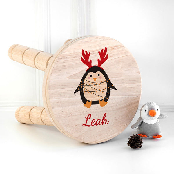 Personalised Christmas Penguin Wooden Stool available to buy at www.giftsfinder.co.uk