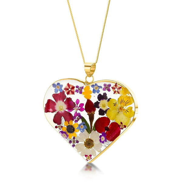 Gold-plated sterling silver heart pendant necklace with real flowers.