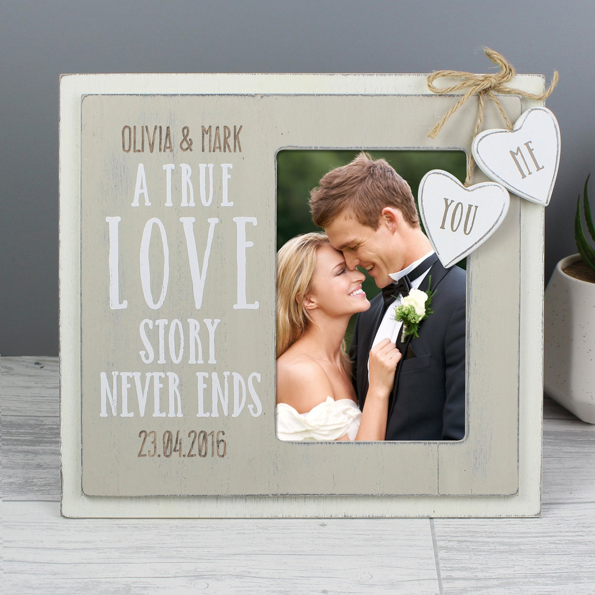 https://www.giftsfinder.co.uk/cdn/shop/files/personalised-love-story-4x6-wooden-photo-frame-41535391334675_1200x.jpg?v=1692262005