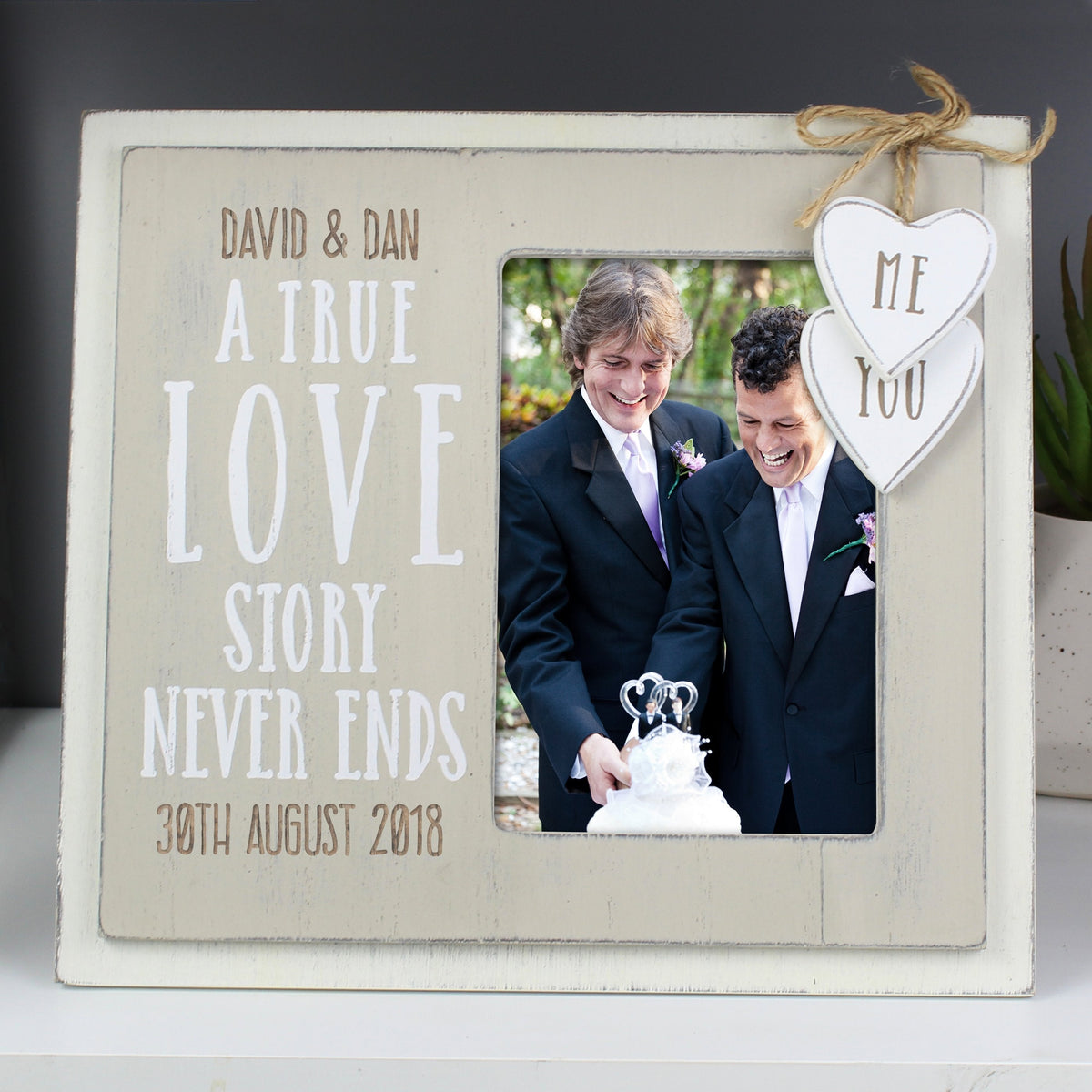 https://www.giftsfinder.co.uk/cdn/shop/files/personalised-love-story-4x6-wooden-photo-frame-41689358139667_1200x.jpg?v=1693199987